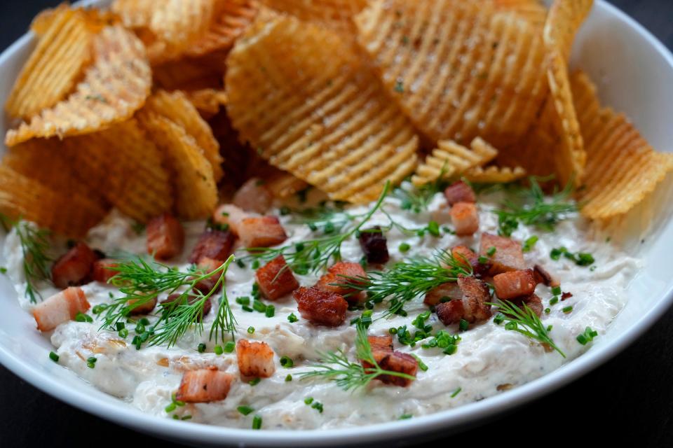 The Charred Onion Dip with cider-braised bacon, fresh herbs, and house-fried chips at LP on 1137 N. King Dr. in Milwaukee on Friday, Oct. 27, 2023.