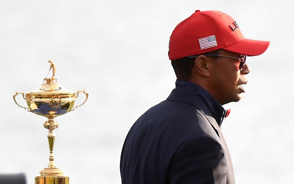 US golfer Tiger Woods walks past the trophy after Europe won the 42nd Ryder Cup at Le Golf National Course at Saint-Quentin-en-Yvelines, south-west of Paris, on September 30, 2018 - FRANCK FIFE/AFP/Getty Images