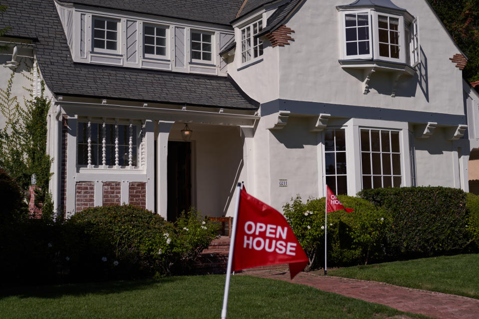 LOS ANGELES, CA - SEPTEMBER 22: An 'open house' flag is displayed outside a single family home on September 22, 2022 in Los Angeles, California. The U.S. housing market is seeing a slow down in home sales due to the Federal Reserve raising mortgage interest rates to help fight inflation. (Photo by Allison Dinner/Getty Images)