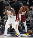 Phoenix Suns center Deandre Ayton reacts after dunking the ball in the second half of Game 4 of an NBA second-round playoff series against the Denver Nuggets, Sunday, June 13, 2021, in Denver. Phoenix won 125-118 to sweep the series. (AP Photo/David Zalubowski)