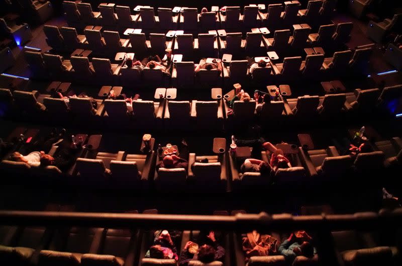 FILE PHOTO: People take their seats inside the Odeon Luxe Leicester Square cinema, on the opening day of the film "Tenet", in London