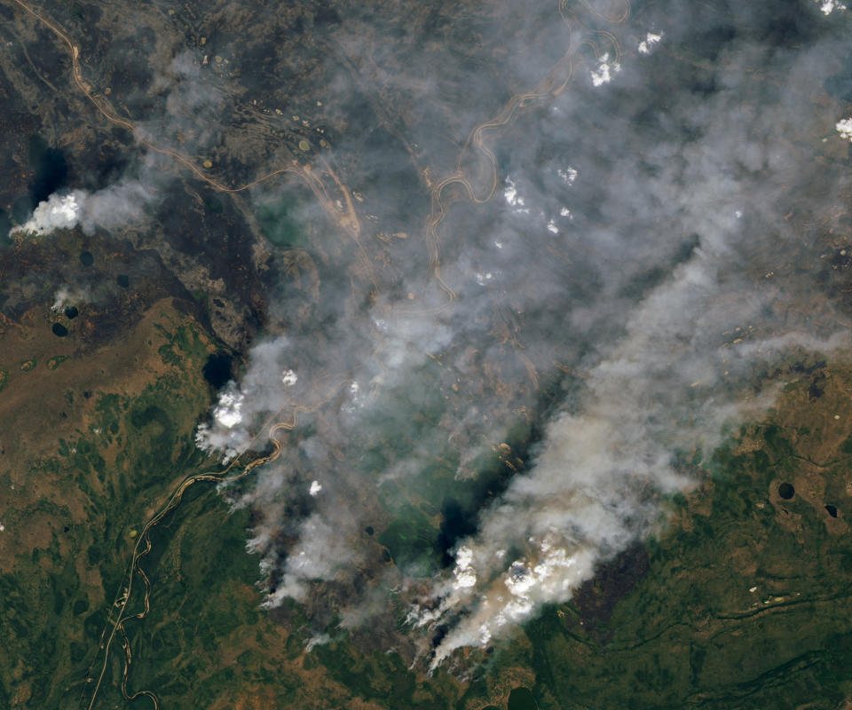 A view shows smoke rising due to wildfire in Yellowknife, Northwest Territories, Canada, August 16, 2023.   NASA EARTH OBSERVATORY/Handout via REUTERS    THIS IMAGE HAS BEEN SUPPLIED BY A THIRD PARTY. MANDATORY CREDIT REFILE - CORRECTING LOCATION FROM BRITISH COLUMBIA TO NORTHWEST TERRITORIES