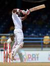 West Indies batsman Darren Bravo hits a four during the third day of the second-of-three Test matches between Australia and West Indies April 17, 2012 at Queen's Park Oval in Port of Spain, Trinidad. AFP PHOTO/Stan HONDA (Photo credit should read STAN HONDA/AFP/Getty Images)