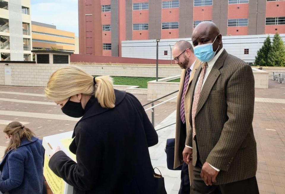 Retired Durham Police Detective Darrell Dowdy walks out of the courtroom on Dec. 1, 2021 with his attorneys after a federal jury found he fabricated evidence and performed an inadequate investigation into a 1991 double murder that resulted in Darryl Howard spending 23 years in behind bars