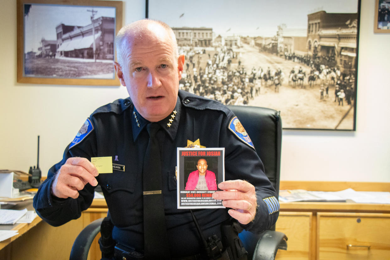 Arcata, California, Police Chief Brian Ahearn holds up a photo of slain student David Josiah Lawson and a note showing how many days Lawson's killing has gone unsolved. (Photo: Matt Krupnick)