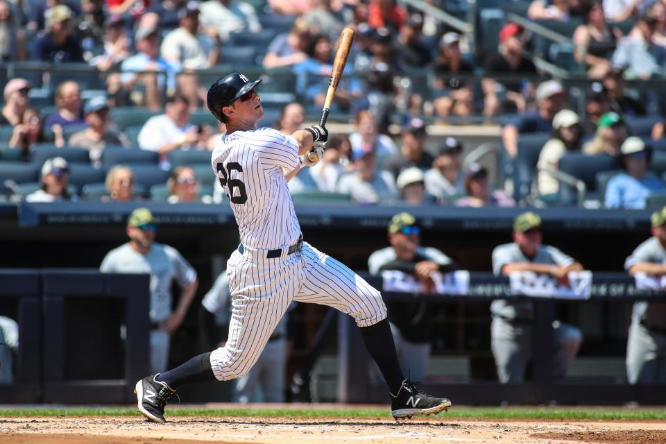 May 21, 2022; Bronx, New York, USA;  New York Yankees third baseman DJ LeMahieu (26) hits a grand slam home run in the second inning against the Chicago White Sox at Yankee Stadium. Mandatory Credit: Wendell Cruz-USA TODAY Sports