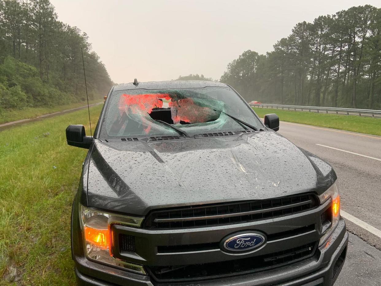 <p>A chunk of roadway smashed the windshield of a truck near Pensacola, Florida</p> (Walton County Fire Rescue)