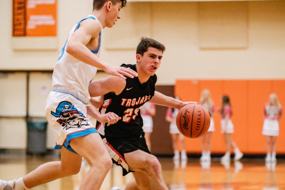 Tusky Valley's Logan Stotzer drives to the basket against Garaway during the Division III district final Friday night.