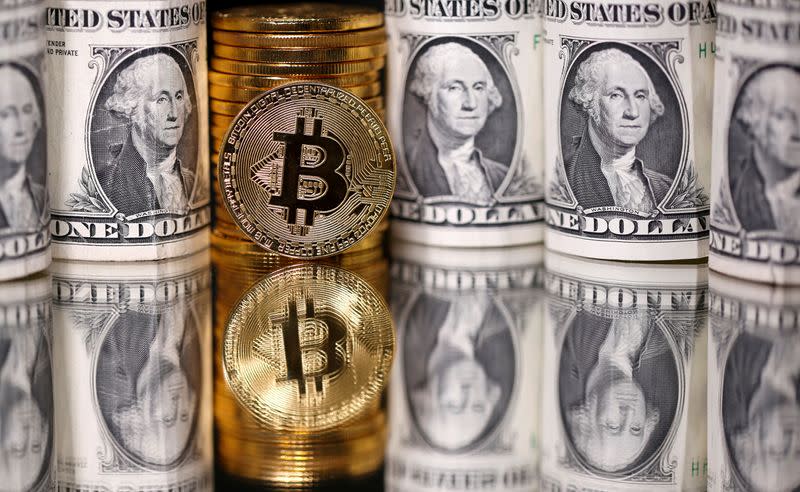 FILE PHOTO: Representations of Bitcoin and U.S. dollar banknotes are seen in this illustration