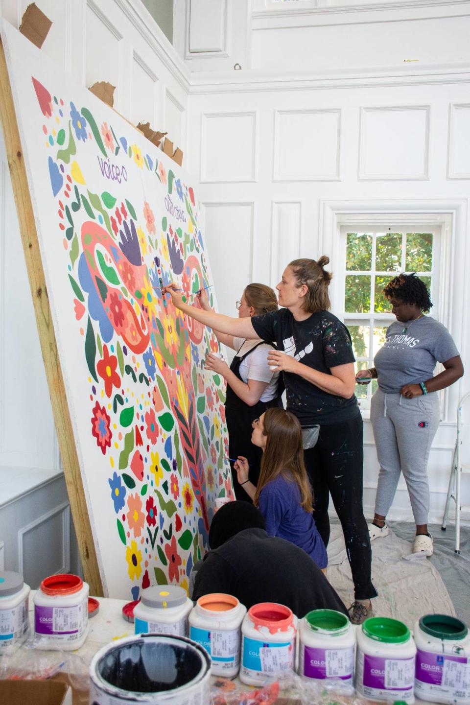 Artist Erin Hawkins “Mama Hawk Draws” and guests paint a mural at Wesleyan College Sept. 17 during a community reproductive rights painting event. Wesleyan will unveil the completed mural during a Rep the Rights Rally on Friday, Sept. 30.