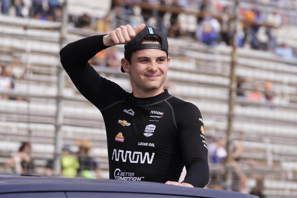 Pato O'Ward of Mexico waves during introductions for the IndyCar auto race at Texas Motor Speedway in Fort Worth, Texas, Sunday, April 2, 2023. (AP Photo/LM Otero)