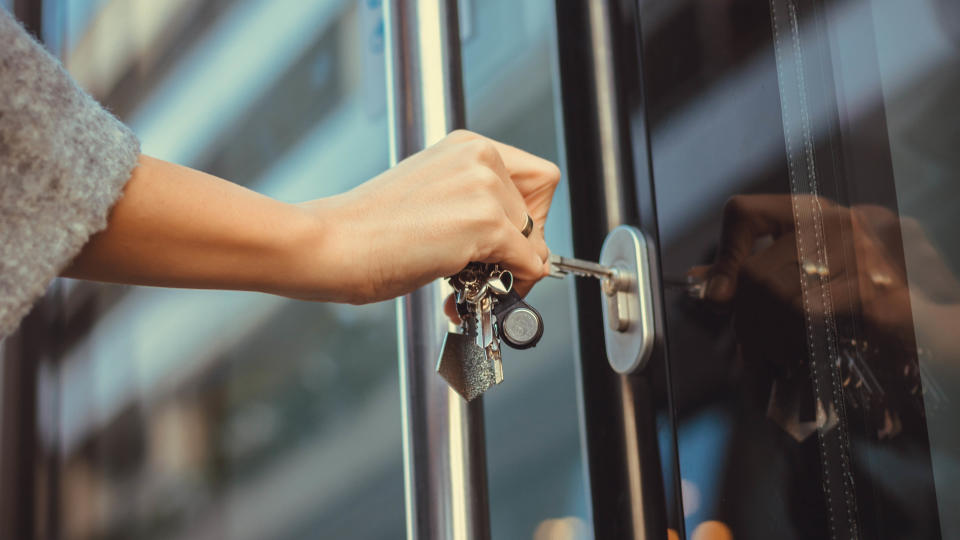 Woman locking door