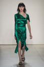 <p><i>Model wears an emerald green silk dress with high slit from the SS18 Dion Lee collection. (Photo: ImaxTree) </i></p>