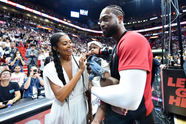 Jesse D. Garrabrant/NBAE via Getty Gabrielle Union and Dwyane Wade with daughter Kaavia