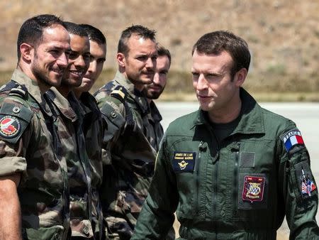 French President Emmanuel Macron (R) meets troops during a visit at the military base in Istres, southern France, July 20, 2017. REUTERS/Arnold Jerocki/Pool