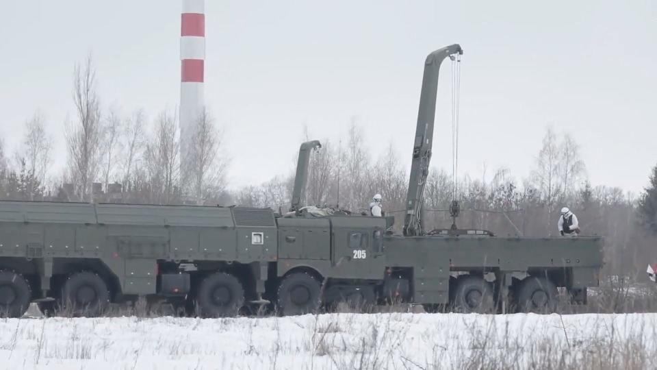 Screenshot of video from Russia's Western Military District showing drills with soldiers, tanks, and missile launchers