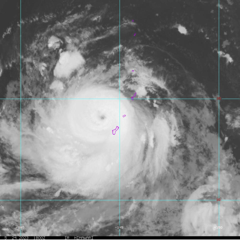 This Himawari-9 infrared satellite image taken at 2 p.m. EDT and provided by NOAA shows Typhoon Mawar passing over the U.S. Pacific territory of Guam, Wednesday, May 24, 2023. (NOAA via AP)