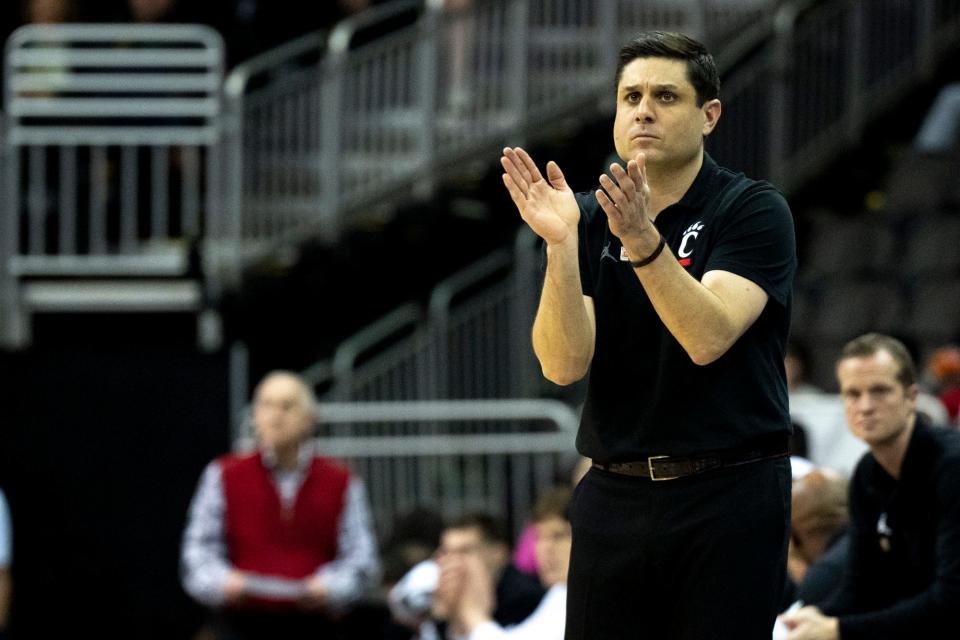 Cincinnati basketball coach Wes Miller reacts during the first half of a Big 12 Conference tournament game Tuesday against West Virginia at T-Mobile Center in Kansas City.