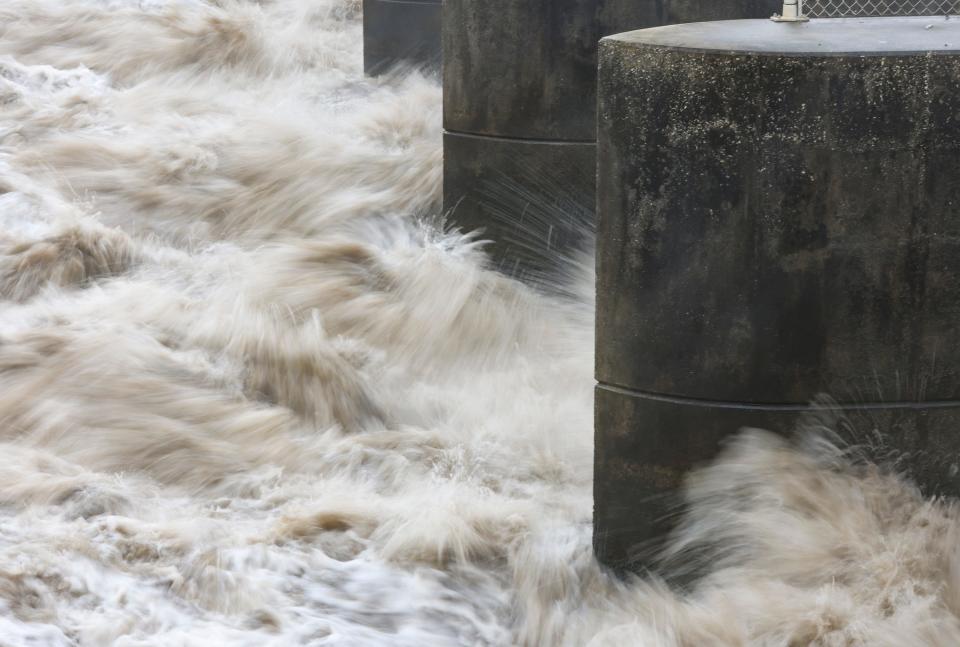 Thirty-three hundred cubic feet per second (cfs) or 2.1 billion gallons of water from Lake Okeechobee is discharged through the St. Lucie Lock and Dam on Monday, Feb. 19, 2024, in Martin County. The discharges, which began Feb. 17, will continue until March 1, according to Army Corps of Engineers officials. The overall average is 1.2 billion gallons per day according to the release schedule. The Army Corps wants to lower the lake level, which is 16 feet 4 inches, in time for summer rains.