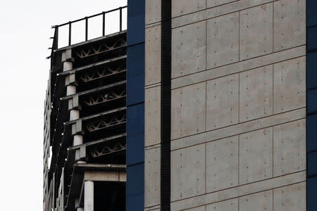 Structural damage is seen on the top five floors of an abandoned 45-storey skyscraper known as the "Tower of David" after an earthquake in Caracas, Venezuela August 21, 2018. REUTERS/Carlos Garcia Rawlins