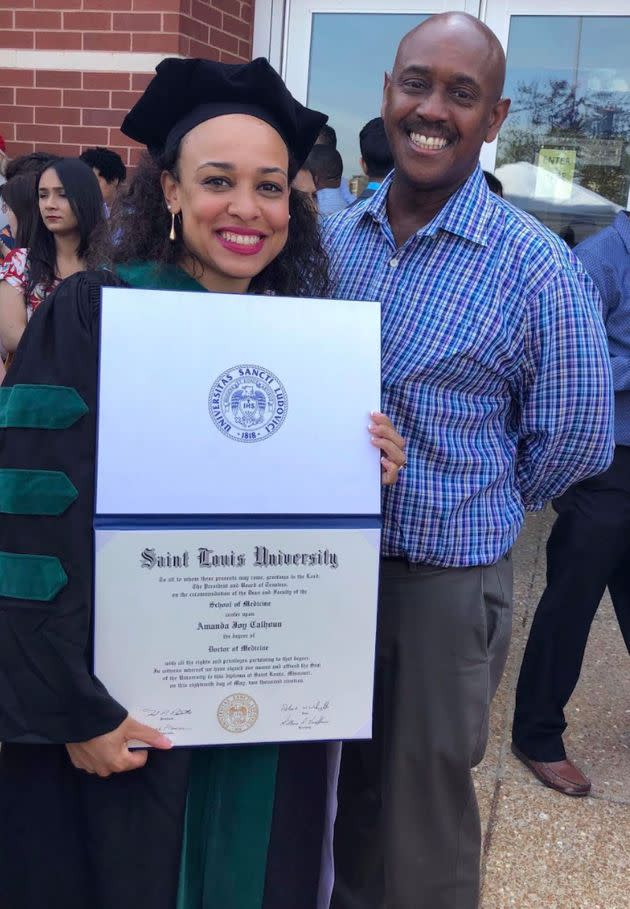 The author with her father at her medical school graduation. (Photo: Courtesy of Amanda J. Calhoun)