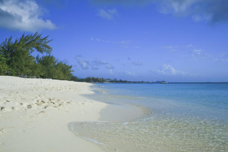 The Cayman Islands and destinations like Seven Mile Beach are popular with vacation travelers.