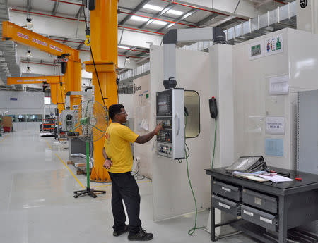 FILE PHOTO: An employee works at Tata Lockheed Martin Aerostructures Ltd., on the outskirts of the southern Indian city of Hyderabad August 20, 2014. REUTERS/Stringer/File Photo