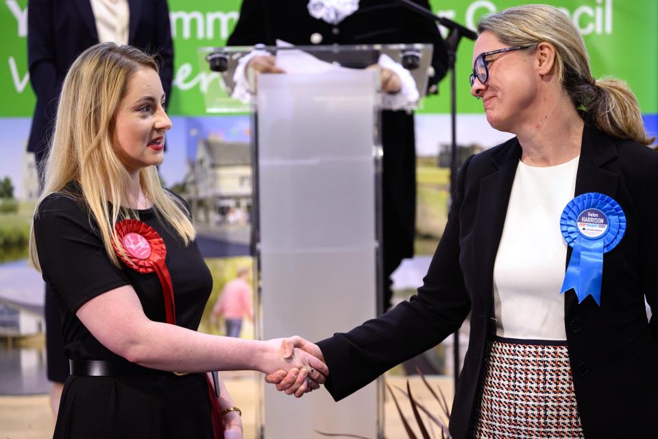 Labour Party candidate Gen Kitchen shakes hands with Conservative Party candidate Helen Harrison after being declared the winner (Getty Images)