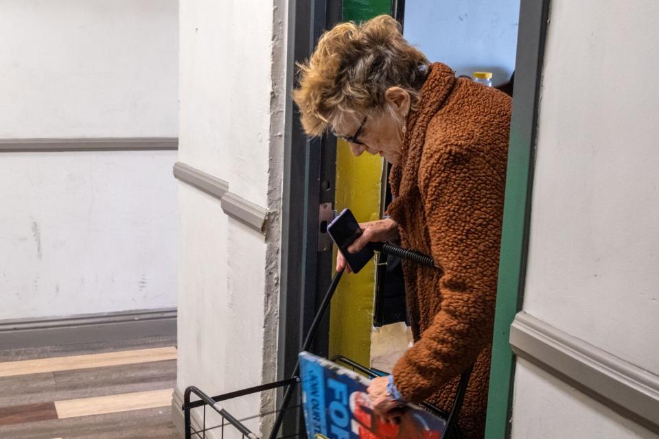 Mary Jacobs arrives home to meet with the Los Angeles Times for an interview inside her single-room occupancy unit