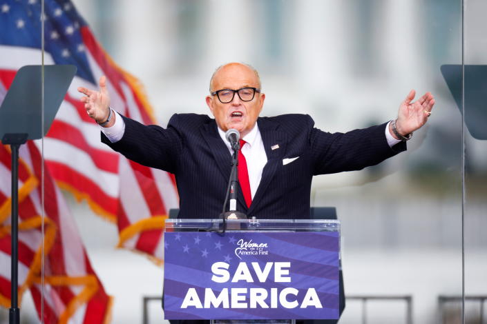 Former President Donald Trump's personal lawyer Rudy Giuliani gestures as he speaks as Trump supporters gather near the White House on Jan. 6, 2021. 