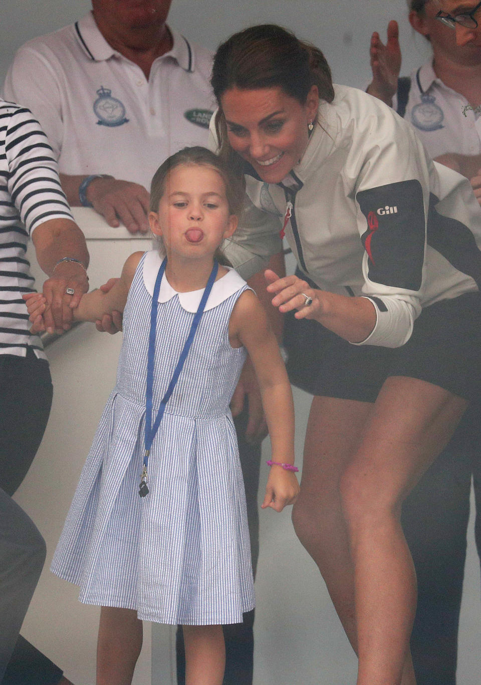 The Duchess of Cambridge with Princess Charlotte look through a window at the prize giving after the King's Cup regatta at Cowes on the Isle of Wight. (Photo by Andrew Matthews/PA Images via Getty Images)