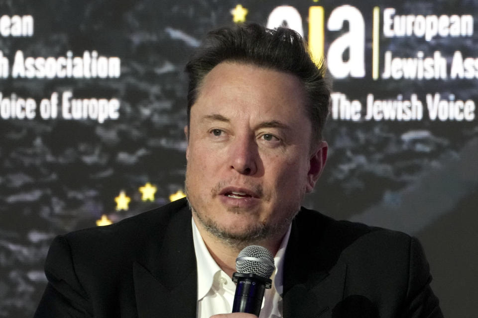 FILE - Tesla and SpaceX CEO Elon Musk addresses the European Jewish Association's conference, Jan. 22, 2024, in Krakow, Poland. Former senior executives of Twitter filed suit against Musk and X Corp. on Monday, March 4, saying they are entitled to more than $128 million total in unpaid severance payments. (AP Photo/Czarek Sokolowski, File)