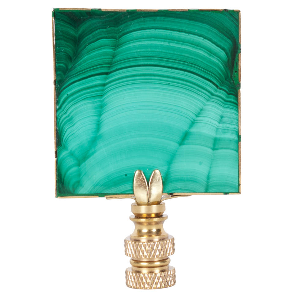 n this undated photo provided by Hillary Thomas Designs, Hillary Thomas’ Billy finial is crafted from a sliver of vibrant green and black malachite, adding a distinctive touch to a lamp. It brings one of fall’s hot trends towards nature and natural elements into play. (AP Photo/Hillary Thomas Designs)