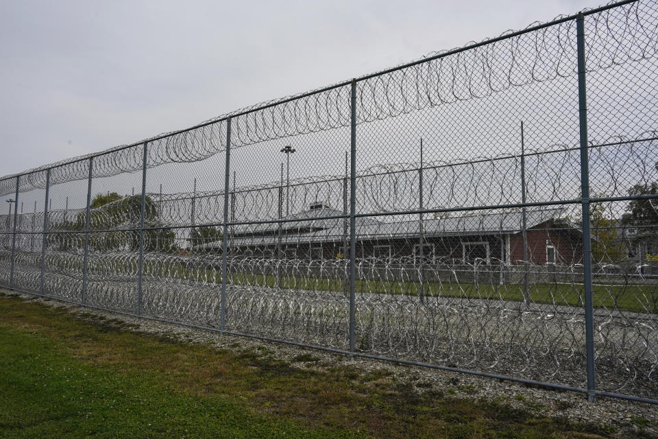The Ohio Reformatory for Women, where Heather Jarvis is incarcerated, is seen beyond a fence and razor wire in Marysville, Ohio, Thursday, Oct. 19, 2023. More than 190,000 women are currently being held in some kind of confinement in the United States — a number that’s been growing rapidly since at least 1980. But experts say programs aimed at helping them stay out of prison haven’t kept pace. (AP Photo/Carolyn Kaster)