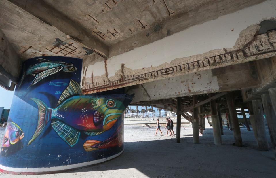 The underside of the Daytona Beach Pier's western end has been struggling with rusting rebar and weakened concrete support structures. The city plans to make repairs. Pictured is the mural painted on the concrete base of the old Space Needle ride.