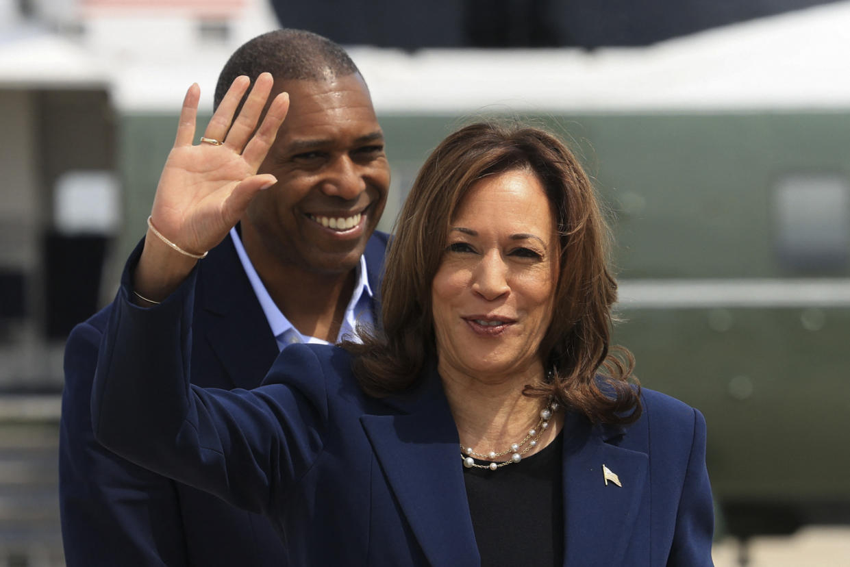 Vice President Kamala Harris waves before boarding Air Force Two.