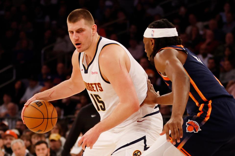 NEW YORK, NEW YORK - JANUARY 25: Nikola Jokic #15 of the Denver Nuggets dribbles against Precious Achiuwa #5 of the New York Knicks during the first half at Madison Square Garden on January 25, 2024 in New York City. NOTE TO USER: User expressly acknowledges and agrees that, by downloading and/or using this Photograph, user is consenting to the terms and conditions of the Getty Images License Agreement. (Photo by Sarah Stier/Getty Images)