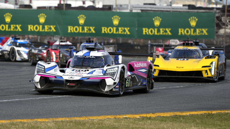 FILE - Meyer-Shank Racing team's Tom Blomqvist in the No. 60 Acura leads the field to start the Rolex 24 hour auto race at Daytona International Speedway, Saturday, Jan. 28, 2023, in Daytona Beach, Fla. Some six weeks after the victory — the third overall for the Shank organization and second consecutive in the most prestigious endurance race in the United States — IMSA ruled that MSR had manipulated tire pressure data while winning the season-opening Rolex 24 at Daytona. Michael Shank spent Friday, Jan. 19, 2024, at his mother’s house in Ohio watching a live timing and scoring feed of the first IMSA practice of the season. (AP Photo/John Raoux, File)