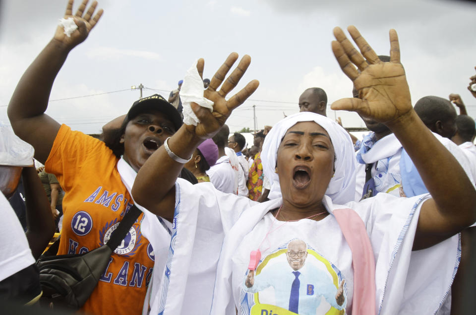 Supporters cheer Ivory Coast's former youth minister Charles Ble Goude upon his return to Abidjan, Ivory Coast, Saturday Nov. 26, 2022, after more than a decade in exile. Ble Goude was acquitted of charges linked to the violence that erupted after the disputed 2010 election when then President Laurent Gbagbo refused to concede. ( AP Photo/ Diomande Bleblonde)