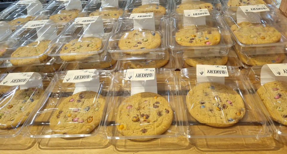 Coles cookies packaged individually in plastic containers