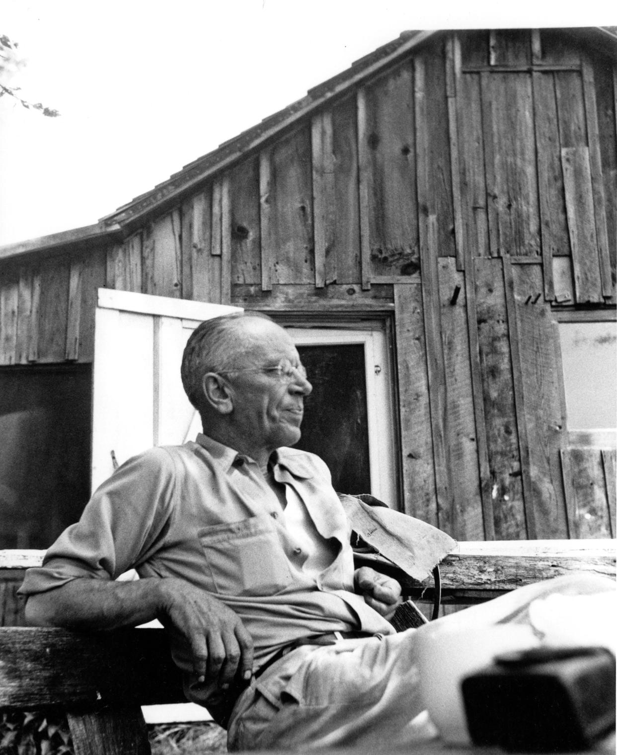 Aldo Leopold, author of "A Sand County Almanac," is photographed outside "The Shack," his family's cabin on their farm in Sauk County.