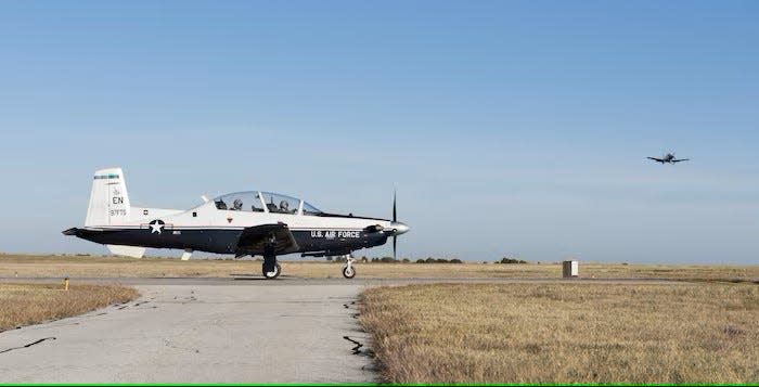 A T-6A Texan II waits for another T-6A to pass before taxing onto the runway Nov. 1, 2017, at Sheppard Air Force Base. The 80th Flying Training Wing hosts the world’s only internationally manned and managed pilot training program in addition to operating the Air Force’s second busiest joint-use airfield outside of a combat zone.