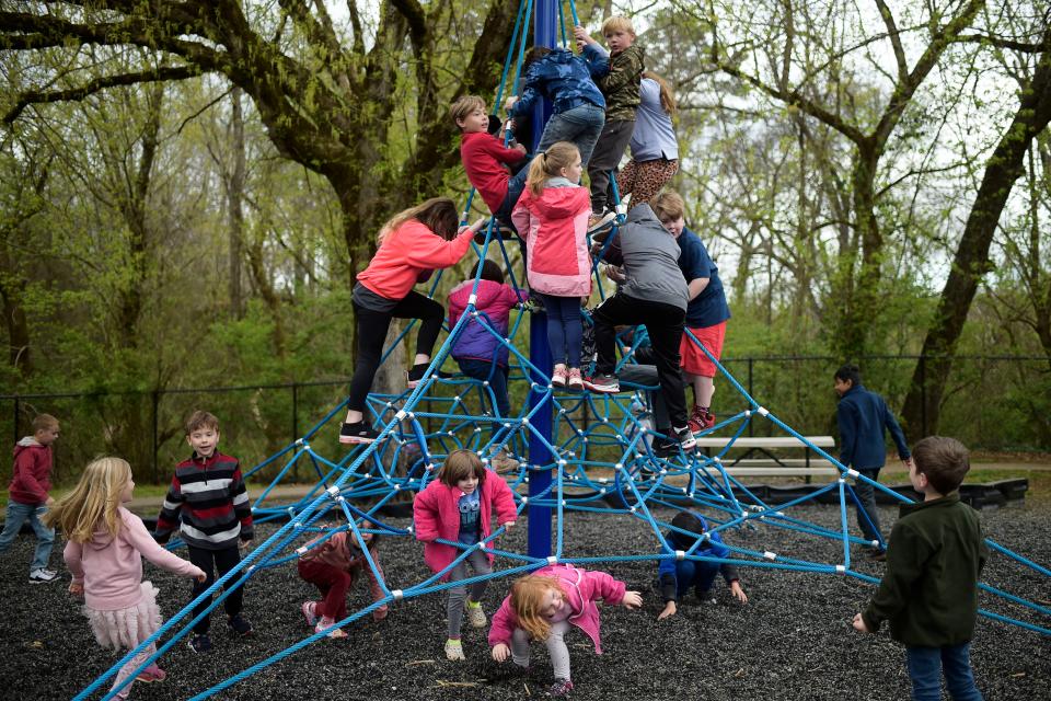 Students climb on their new playground at Mount Olive Elementary School in South Knoxville.