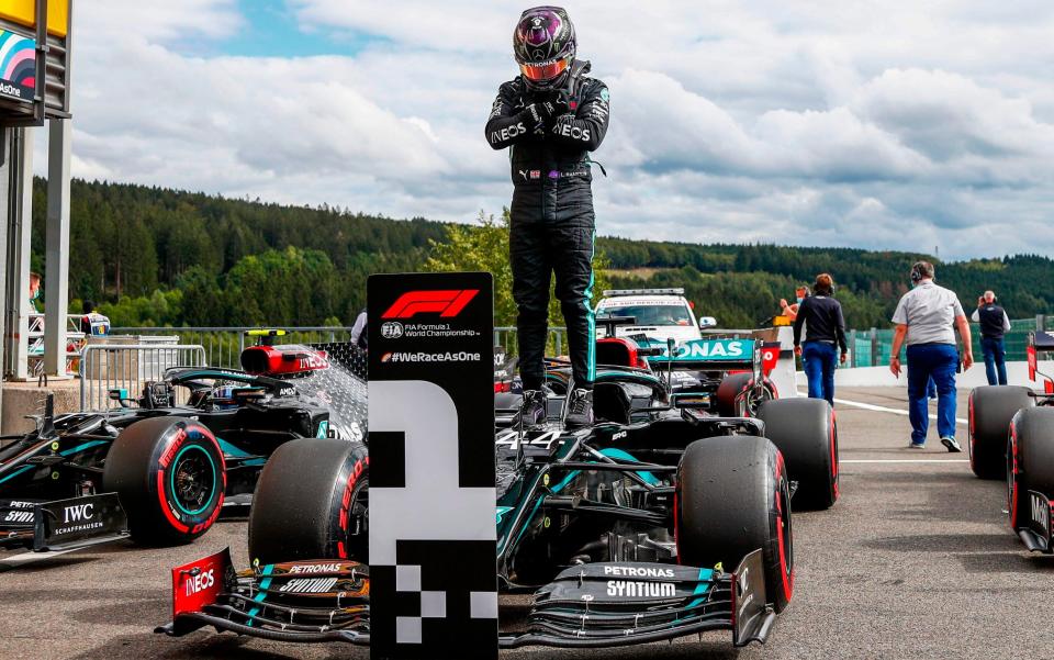 Mercedes' British driver Lewis Hamilton gestures as he poses after securing his 93rd pole position during the qualifying session at the Spa-Francorchamps circuit in Spa on August 29, 2020 ahead of the Belgian Formula One Grand Prix - AFP/ FRANCOIS LENOIR