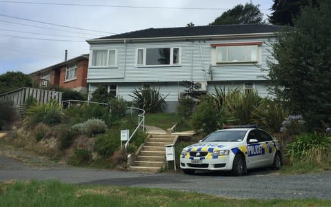 Police remain outside a house on Sommerville St, Dunedin, associated with gunman Brenton Trent. - Credit: Claire Drake