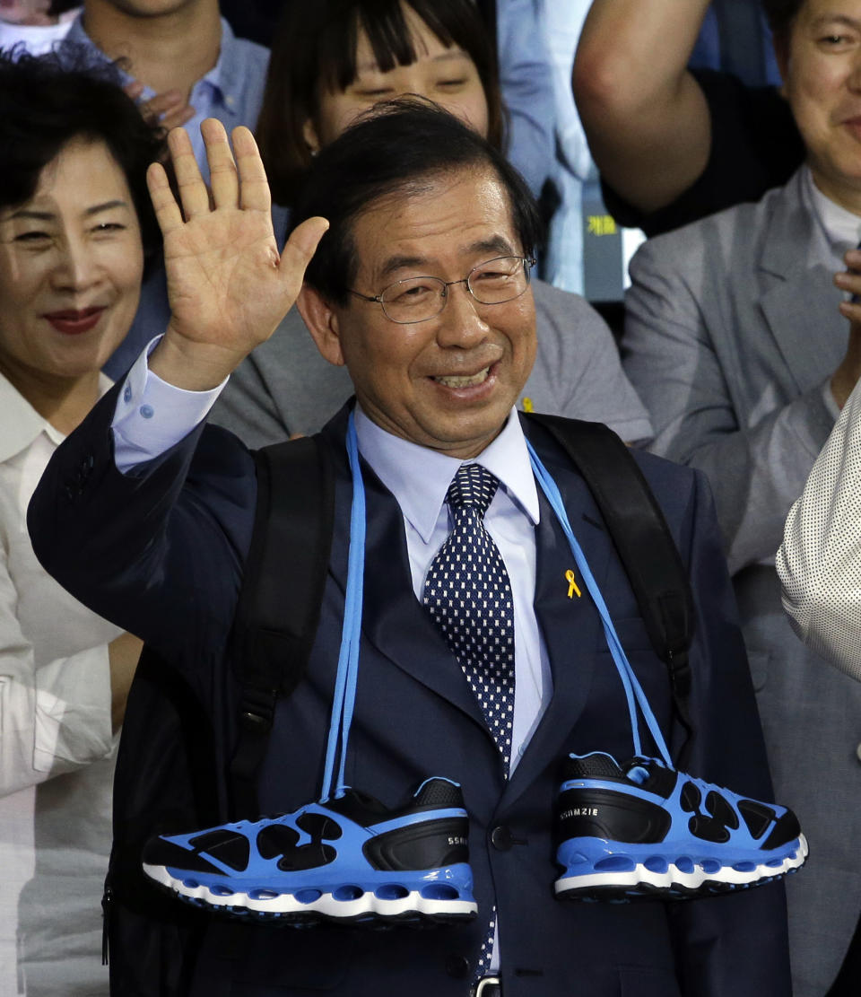 FILE - In this June 5, 2014, file photo, Park Won-soon, then candidate for Seoul city mayor of the main opposition party New Politics Alliance for Democracy celebrates his victory in the Seoul mayoral election at his office in Seoul, South Korea. Police say on Thursday, July 9, 2020, Park, the current mayor of South Korean capital Seoul, has been reported missing and search operations are underway.(AP Photo/Lee Jin-man, File)