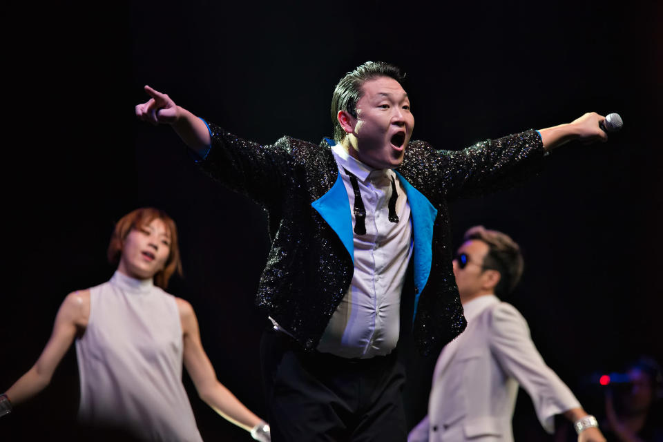 Dressed in his trademark black suit and sunglasses, Psy launched into his three-song setlist with rap number "Champion", to which he got the fanatical audience to chant "Champion, Champion" with him.