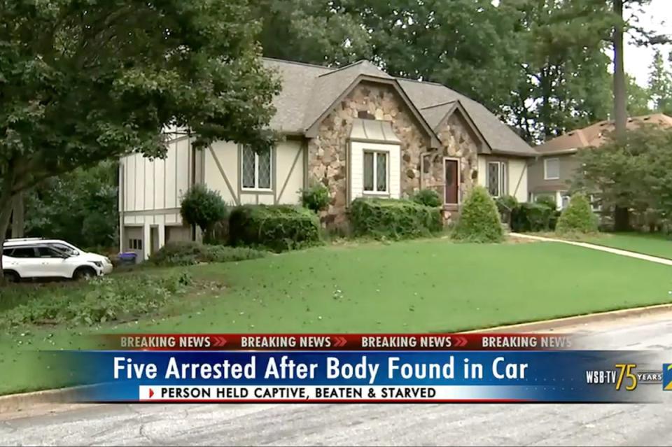 House in Lawrenceville, Georgia, searched by police after a dead body was found in the back of a car (WSB-TV)