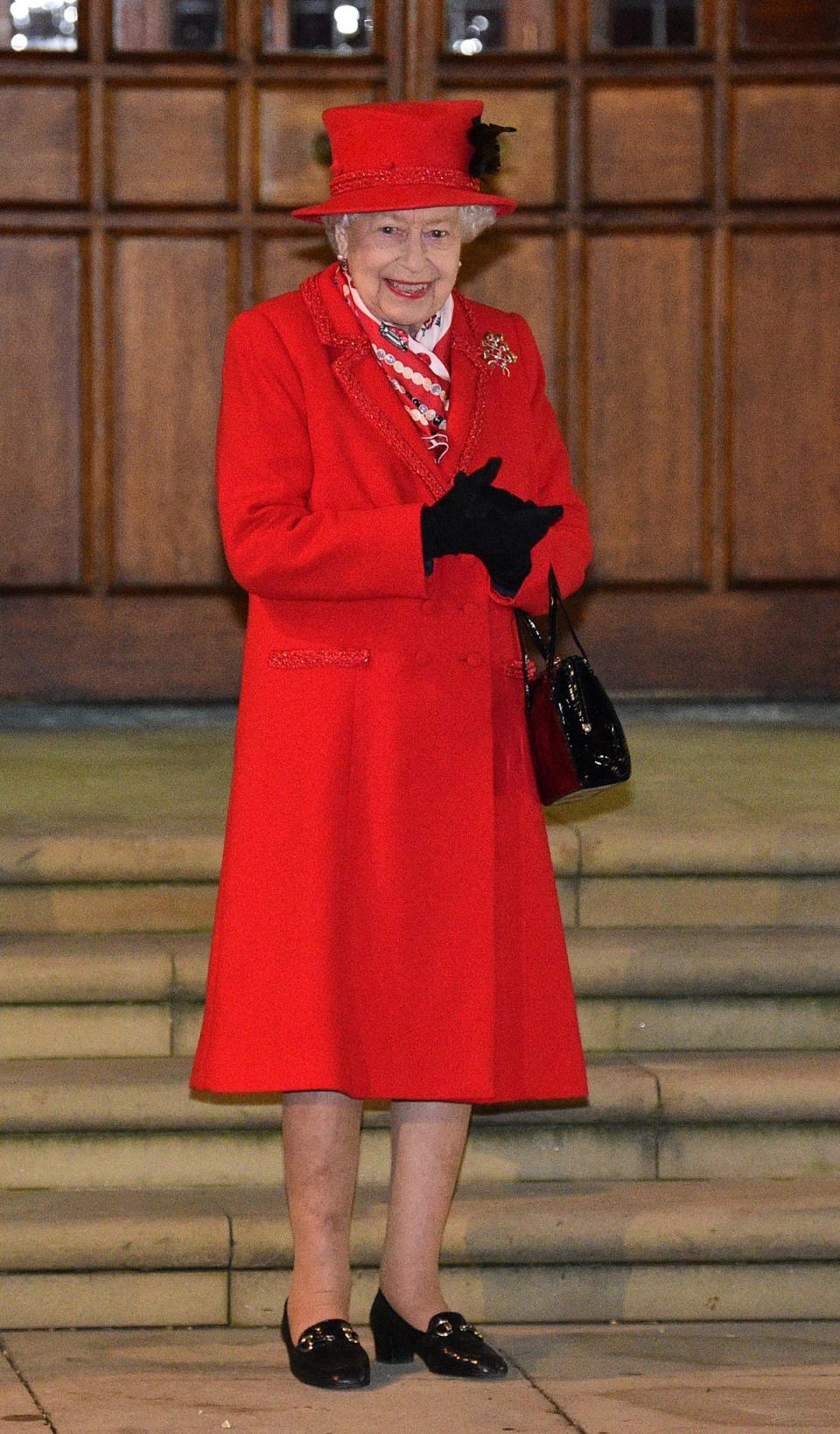 Queen Elizabeth II, stands in the quadrangle at Windsor Castle at Christmas (Glyn Kirk/PA) (PA Archive)