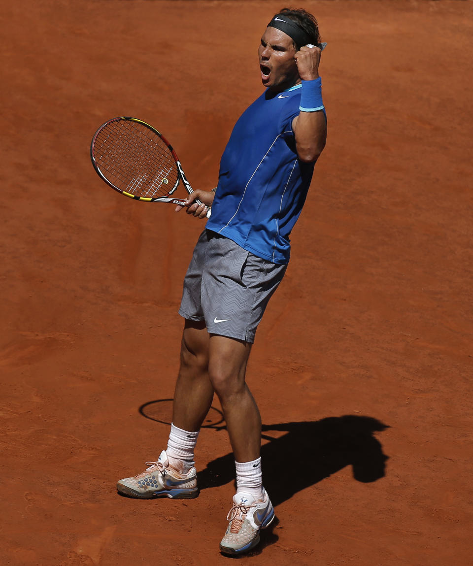 Rafael Nadal from Spain celebrates a point during a Madrid Open tennis tournament match against Tomas Berdych from Czech Republic in Madrid, Spain, Friday, May 9, 2014. (AP Photo/Andres Kudacki)